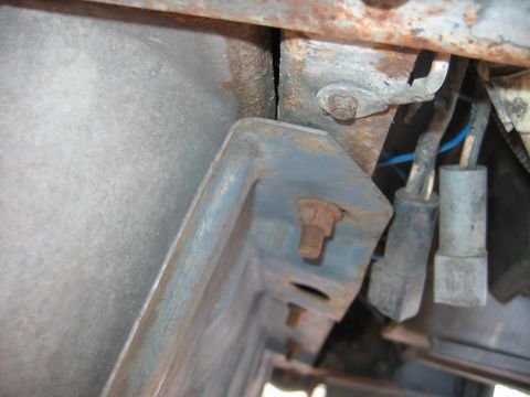 1992 Ford Bronco - unknown ground behind rear bumper rear next to gas tank, may be for back up lights or trailer connection