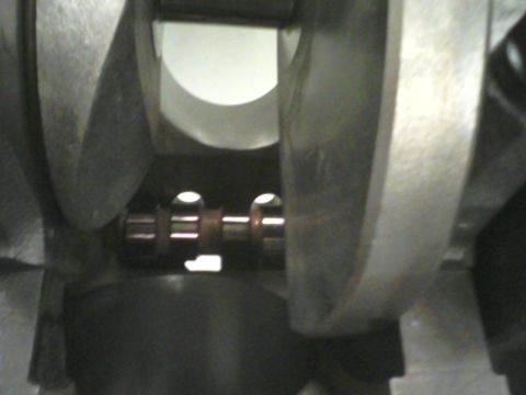 1988 Ford Mustang - Close-up view of a crankshaft, showing its bearing journals and counterweights.