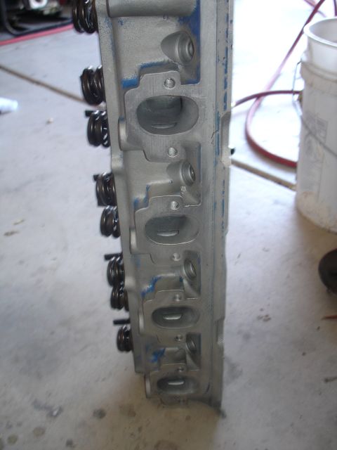 1988 Ford Mustang - Close-up of an engine cylinder head, showing valve springs and ports.