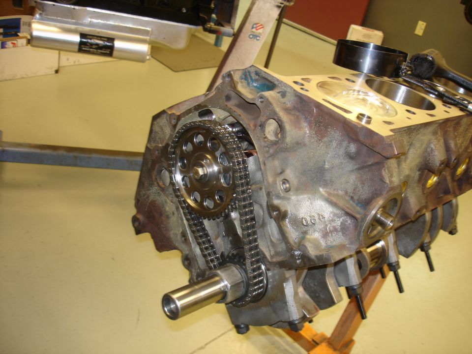 Engine block showing timing chain and gears. Some numbers are visible on the block