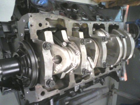 1988 Ford Mustang - Close-up view of an engine block's internal components, including the crankshaft and connecting rods.