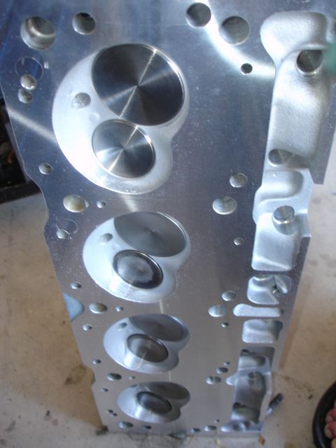 1988 Ford Mustang - Close-up view of a clean engine cylinder head, showing intake and exhaust ports.