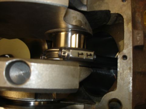 1988 Ford Mustang - This image shows a close-up view of an engine's internal components, specifically the crankshaft and a connecting rod bearing.