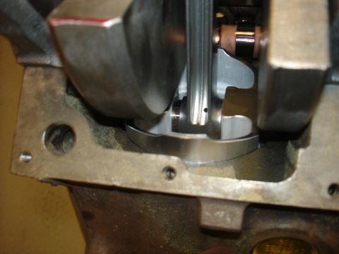1988 Ford Mustang - Close-up view of an engine's crankshaft and connecting rod assembly, showing internal mechanical components.