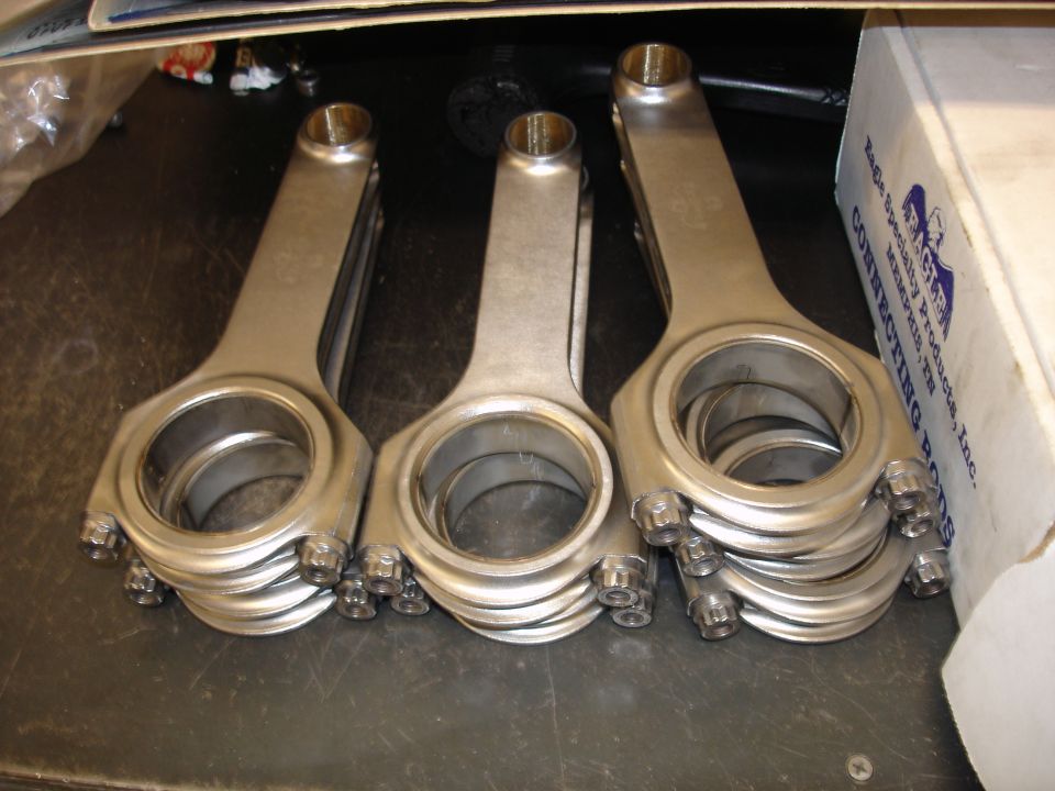 Stack of Eagle Specialty Products connecting rods in a box