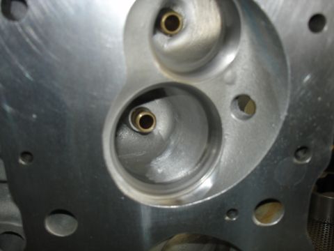 1988 Ford Mustang - This is a close-up view of an engine's cylinder head, showing the intake ports and valve seats.