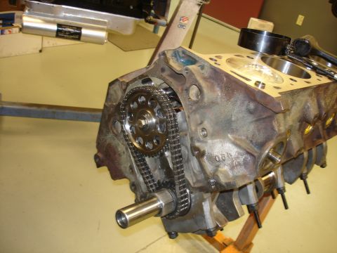 1988 Ford Mustang - Close-up view of an engine block's timing chain and gears assembly, with visible casting numbers.