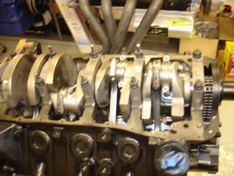 1988 Ford Mustang - Close-up of an engine block's internal components, including the crankshaft and connecting rods.