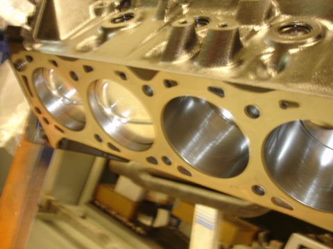 1988 Ford Mustang - The image shows the inside of an engine block with visible cylinder bores and bolt holes for a gasket.