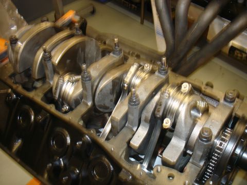 1988 Ford Mustang - Close-up view of an engine's internal components, including the crankshaft and connecting rods.
