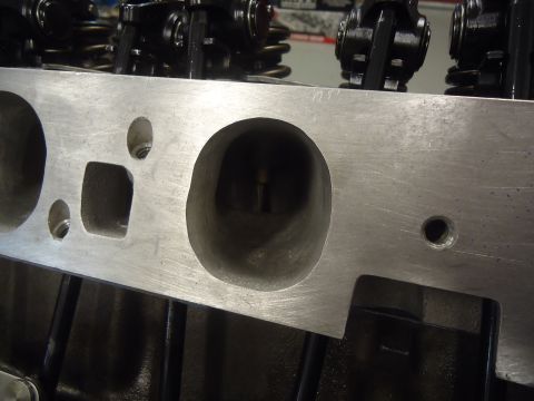 1988 Ford Mustang - Close-up view of an engine's aluminum cylinder head, showing internal components.