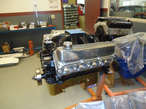 1988 Ford Mustang - Two Chevrolet V8 engines are shown on stands in a workshop environment.
