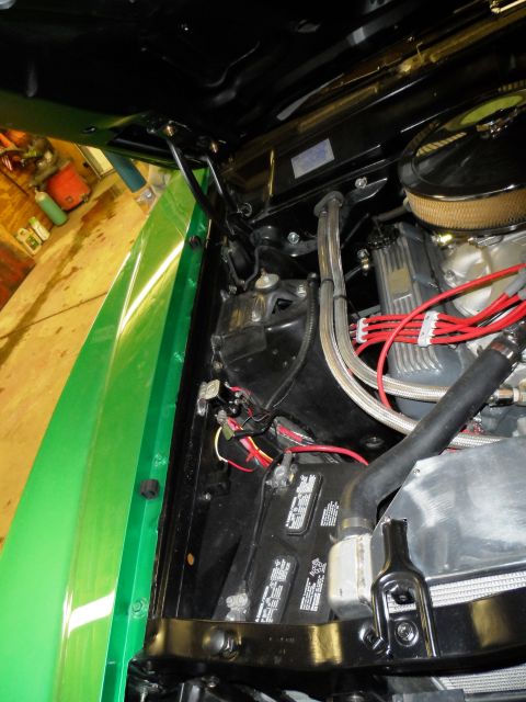 1971 Ford Ranchero - Close-up of a vehicle's engine bay, focusing on the battery and wiring components.