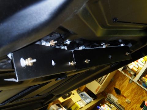 1971 Ford Ranchero - Close-up view of aftermarket brackets installed on the undercarriage of a vehicle.