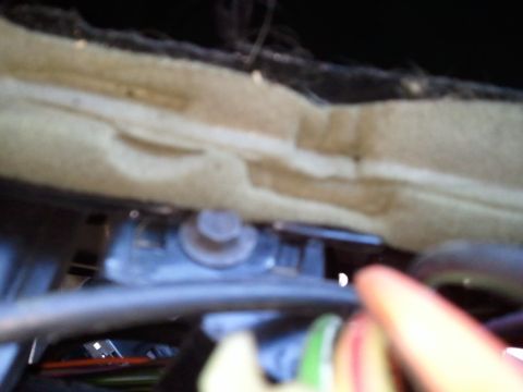 1994 Ford Bronco - Close-up view of an interior dash component, showing a bolt and some wiring.