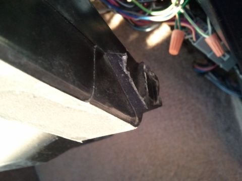 1994 Ford Bronco - Close-up of damaged dashboard trim and wiring harness with visible wire nuts.