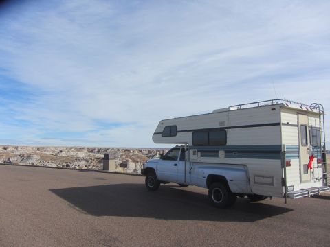 1997 Dodge 3500 - 1997 Dodge 3500 pickup truck with camper shell parked on a scenic overlook.