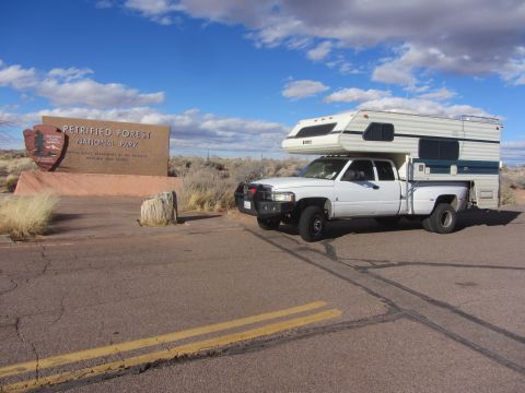 1997 Dodge 3500 - 1997 Dodge 3500 pickup truck with camper shell at Petrified Forest National Park entrance.