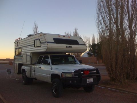 1997 Dodge 3500 - This 1997 Dodge 3500 pickup truck is equipped with a camper shell and a festive bull bar.