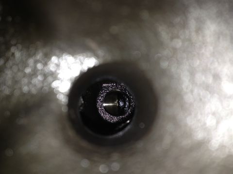 1989 Ford Bronco - Detail of an engine component, likely a valve or similar part.