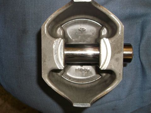 1971 Ford Ranchero - This image shows a close-up view of a piston and connecting rod assembly, likely from an engine.