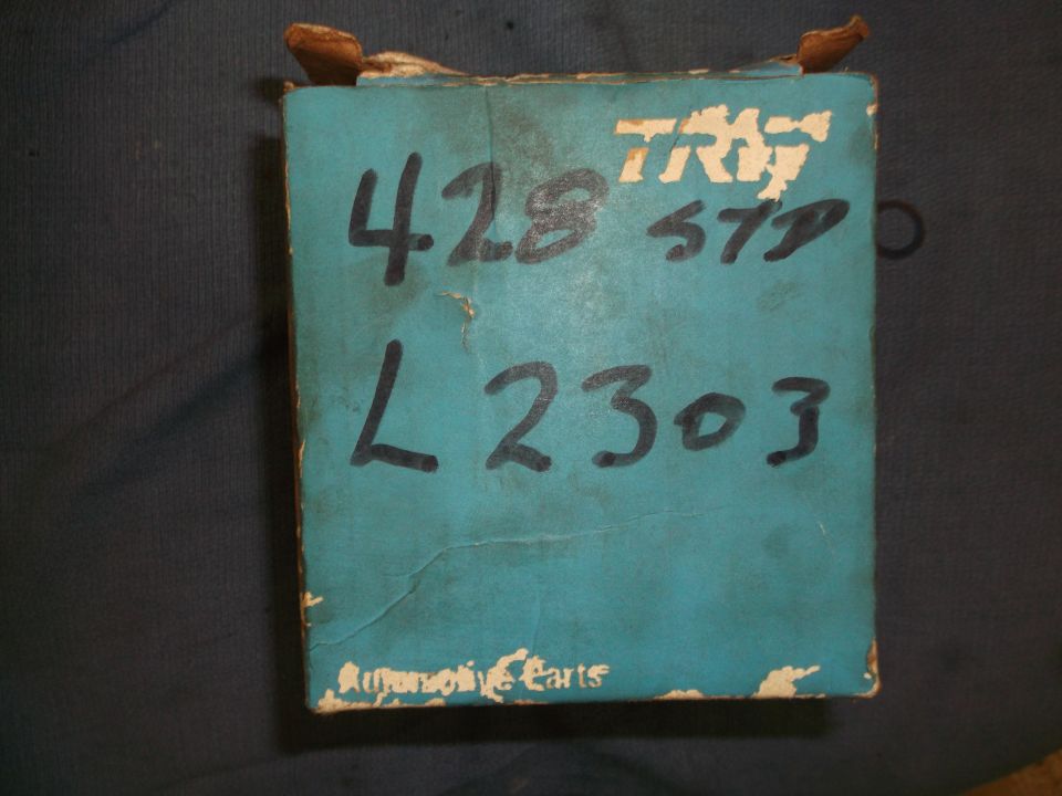 Turquoise cardboard box with black handwritten text '428 57D L2303' and 'TRW' logo