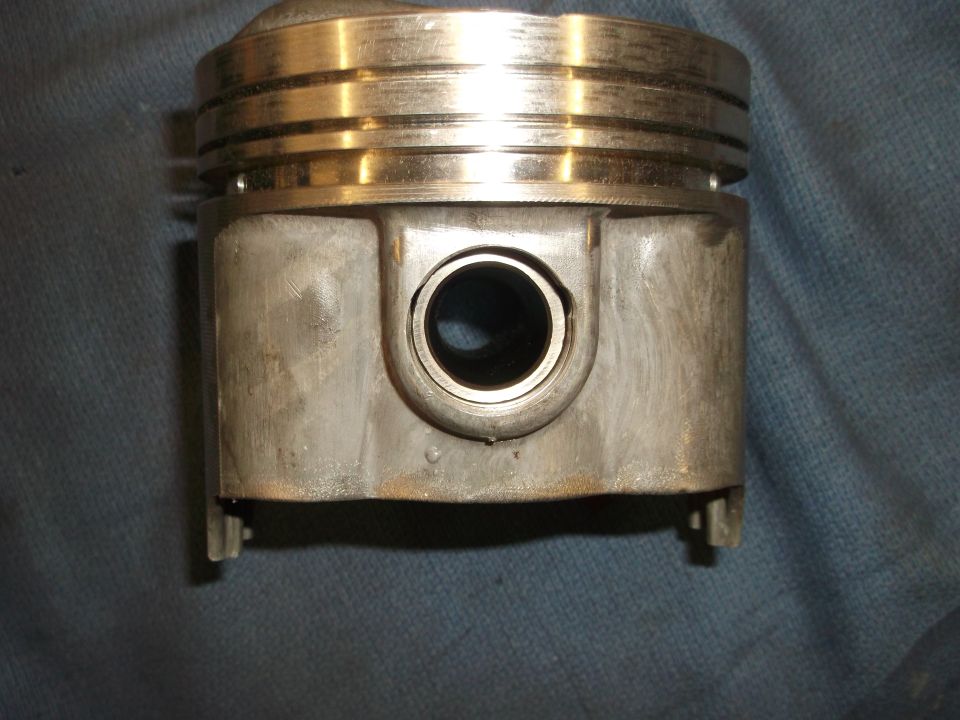 Piston with two compression rings and a wrist pin bore