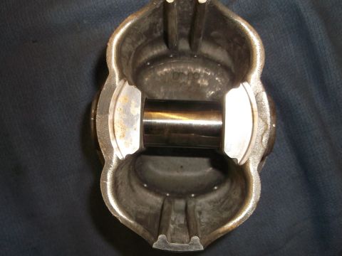 1971 Ford Ranchero - Close-up of a single engine piston with its wrist pin.