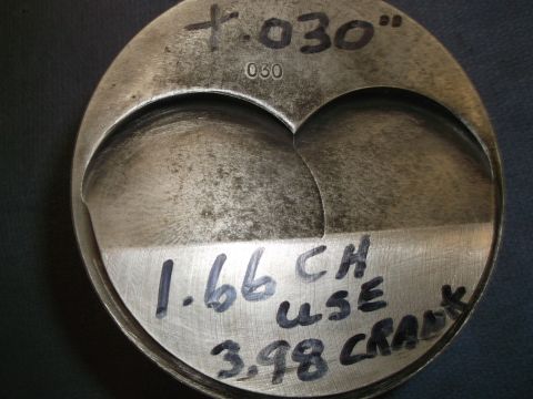 1971 Ford Ranchero - A close-up view of a metal piston with various measurements and notes written on its surface.