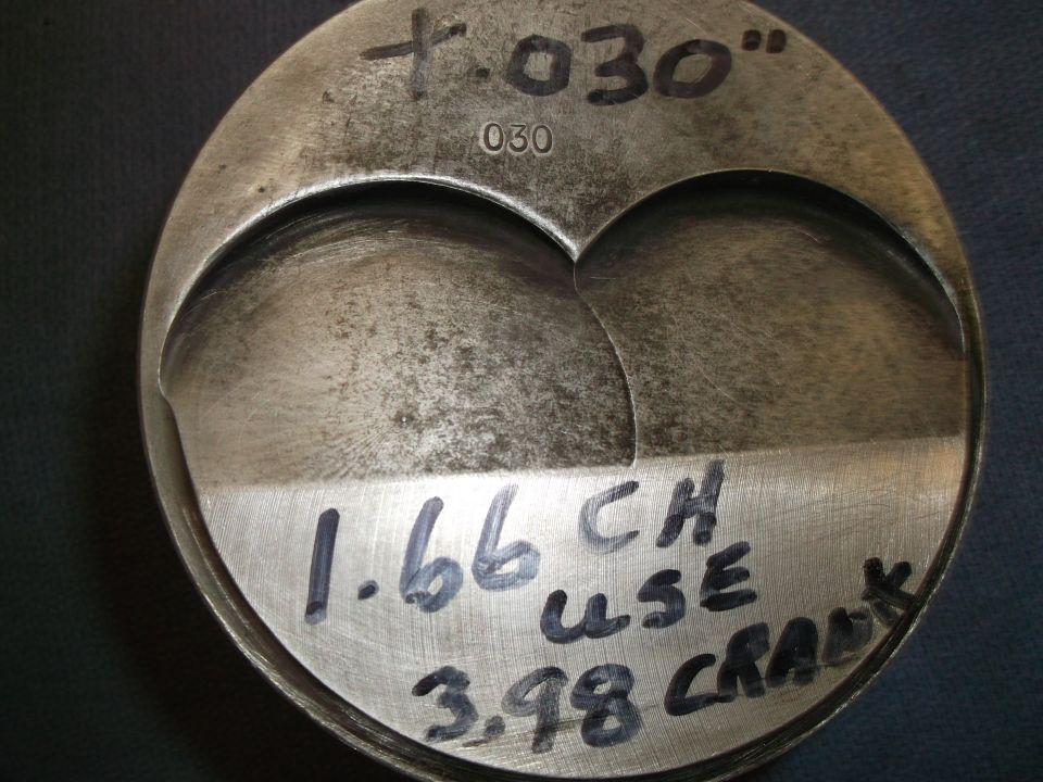 Metal piston with handwritten markings '+.030', '030', '1.66 CH USE', and '3.98 CRANK'