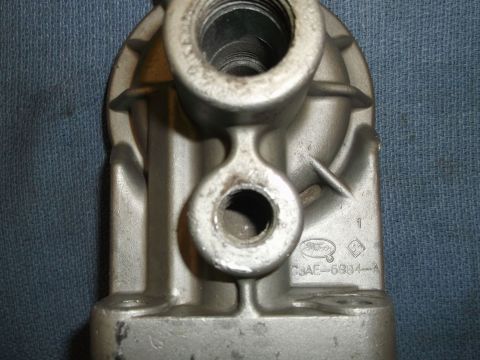 1971 Ford Ranchero - A close-up view of a metal automotive component, identified by a Ford emblem and part number.