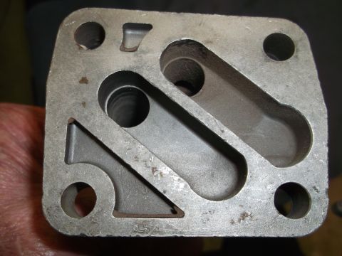 1971 Ford Ranchero - Close-up view of a metal component intricate internal channels and mounting holes.