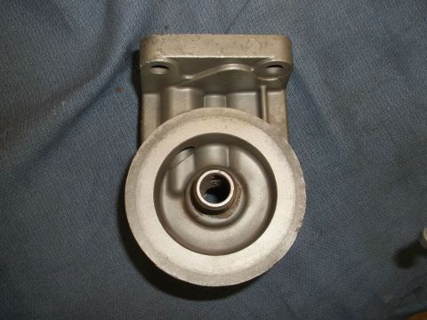 1971 Ford Ranchero - Metal oil filter housing shown on a blue cloth background.
