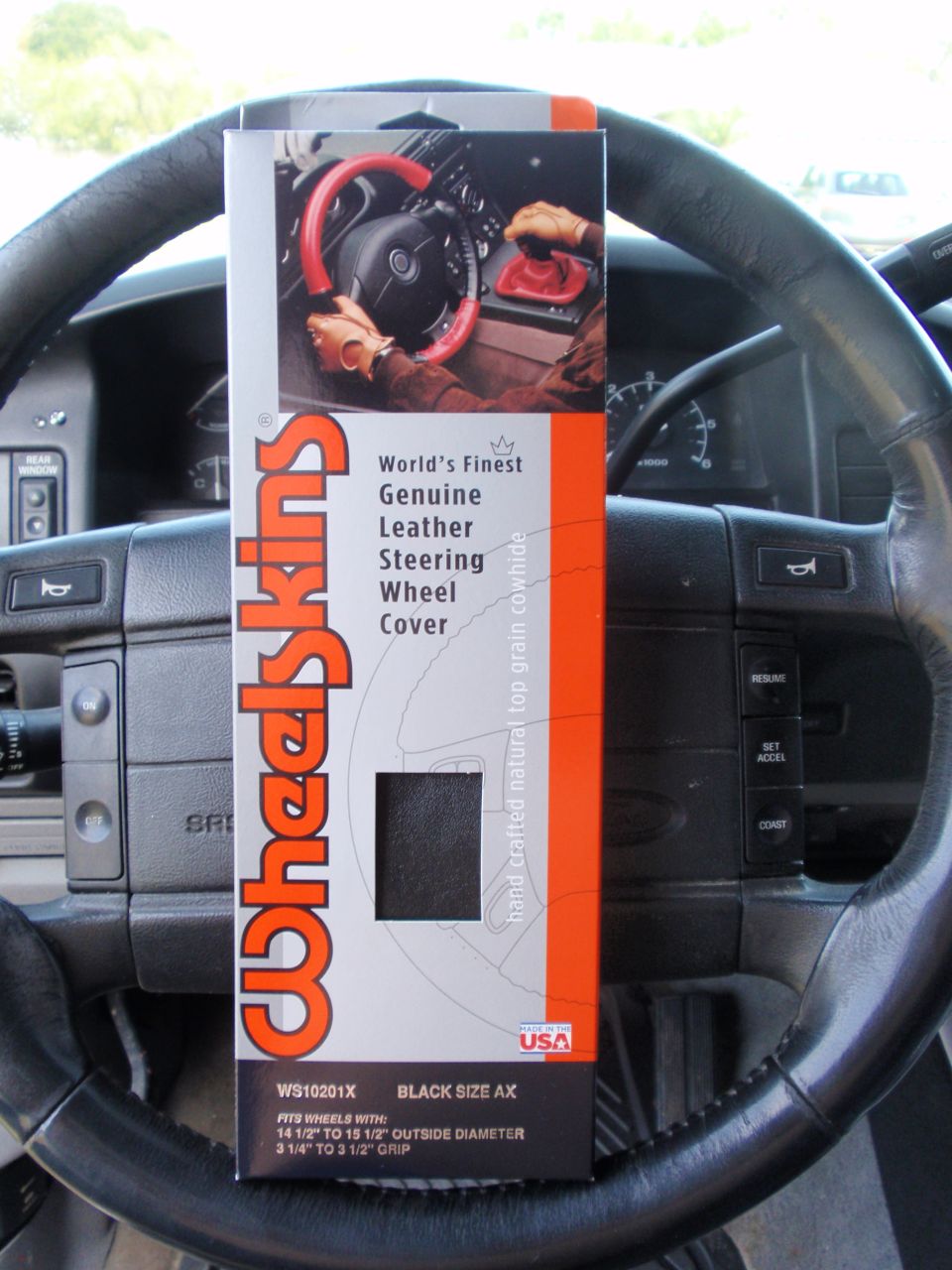 Steering wheel cover packaging inside a car interior