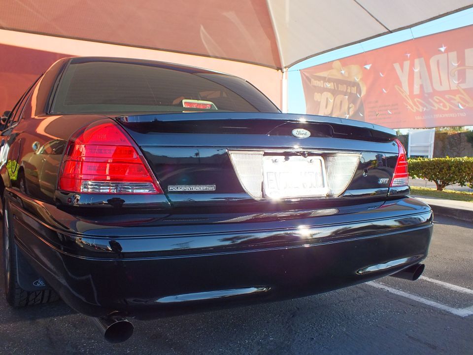 Black Crown Victoria rear with POLICE INTERCEPTOR badge and tinted glass
