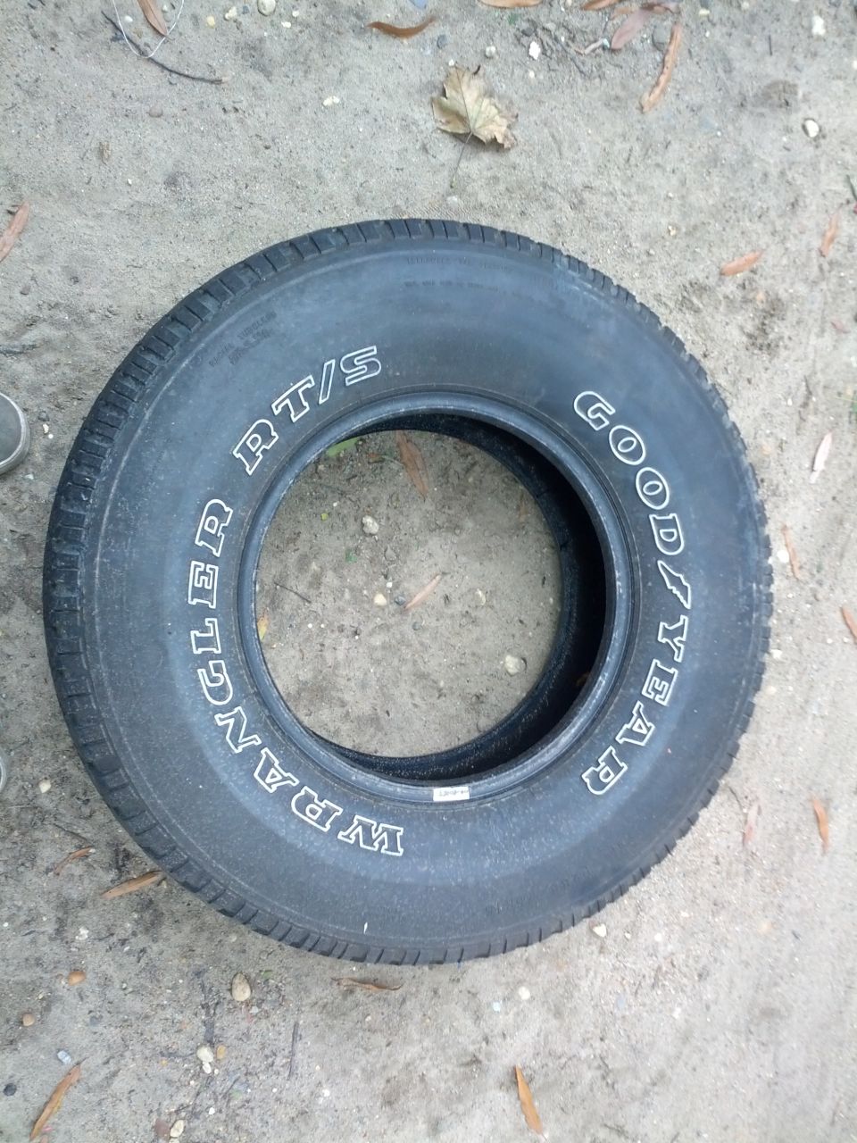 Goodyear Wrangler RT/S tire on dirt ground