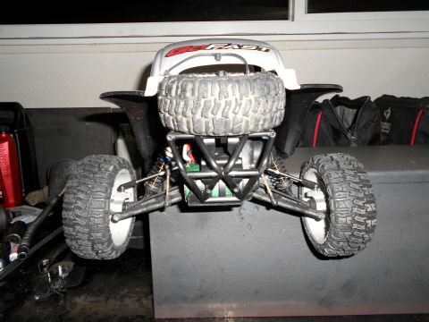 1996 Ford Bronco - Rear view of a remote-controlled car with a spare tire mounted on its back.