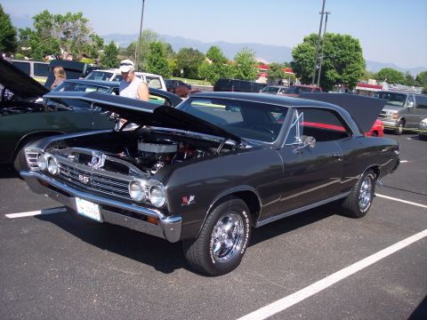 1972 Ford Ranchero - Dark gray 1967 Chevrolet Chevelle SS coupe with hood open at a car show.
