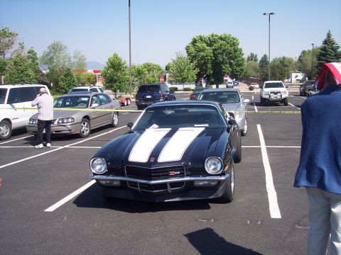 1972 Ford Ranchero - A black 1970 Chevrolet Camaro Z28 is parked in a lot with other vehicles.