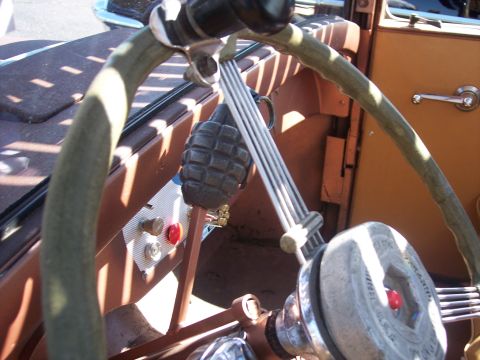 1972 Ford Ranchero - The interior of a custom vehicle features a unique grenade gear shift and a modified steering wheel.