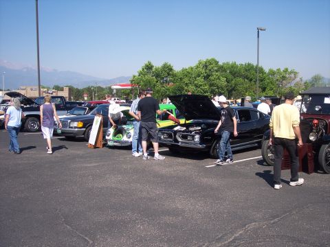 1972 Ford Ranchero - A black coupe, likely a 1968 model, is displayed with its hood open at an outdoor car show.