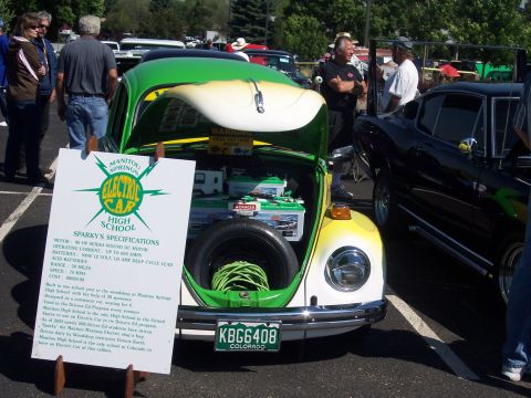 1972 Ford Ranchero - A custom electric Volkswagen Beetle is displayed with its specifications for attendees to read.