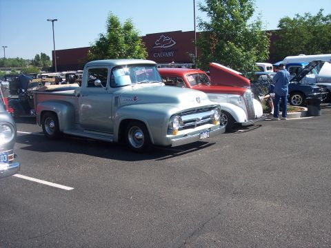 1972 Ford Ranchero - A classic silver 1956 Ford F-100 pickup truck is parked at an outdoor event.