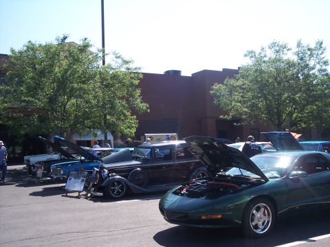 1972 Ford Ranchero - Several cars are displayed with their hoods open at an outdoor gathering.