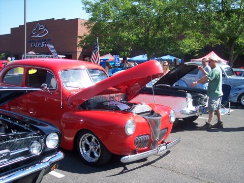 1972 Ford Ranchero - Several classic cars are on display at an outdoor event.