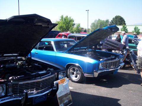 1972 Ford Ranchero - A blue 1972 Ford Ranchero is displayed with its hood open at a car show.
