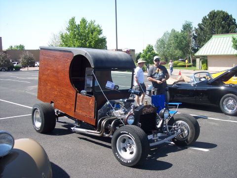 1972 Ford Ranchero - Custom hot rod with wooden body and exposed engine at a car show.