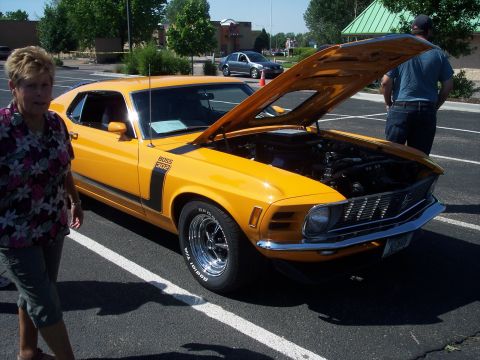 1972 Ford Ranchero - Yellow 1970 Ford Mustang Boss 302 on display, hood open showing the engine bay.