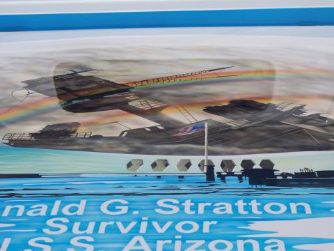 1972 Ford Ranchero - Close-up of airbrushed mural artwork on a light-blue painted vehicle panel depicting the USS Arizona Memorial with the sunken battleship, a…