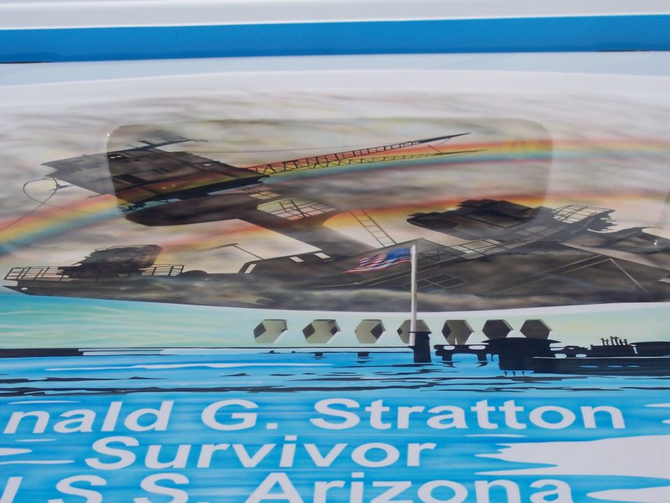 Airbrushed USS Arizona Memorial tribute mural on a vehicle panel honoring survivor Donald G. Stratton